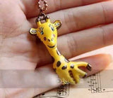 Giraffe Yellow with Green Eyes on Brass Round Necklace